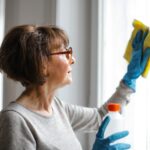 woman cleaning window